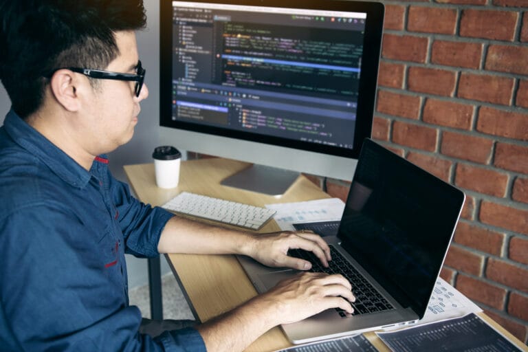 Asian man working code program developer computer web developmen